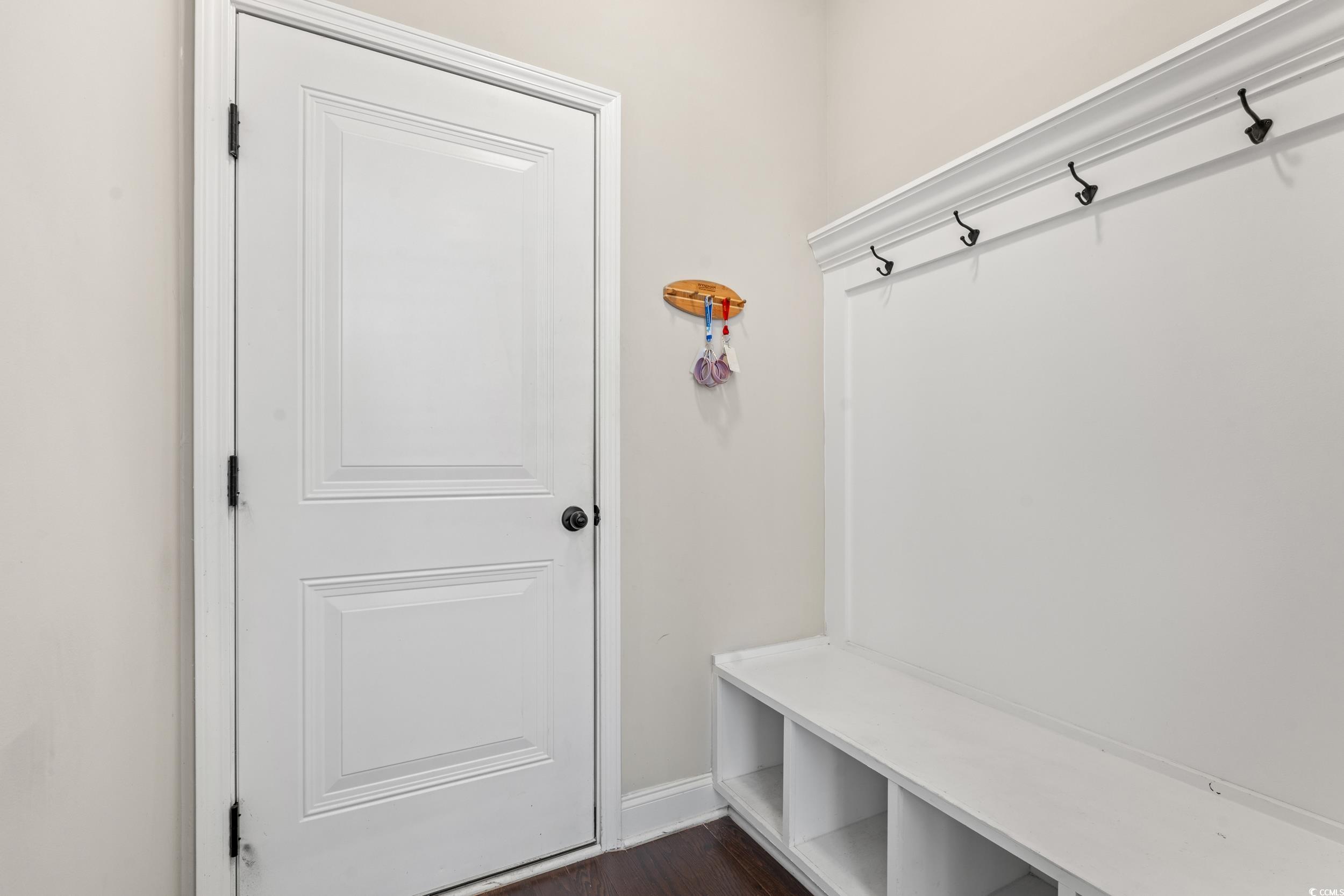 126 Viareggio Road Myrtle Beach, SC 29579 - Photo 25 of 40 Mudroom featuring baseboards and dark wood-style floors