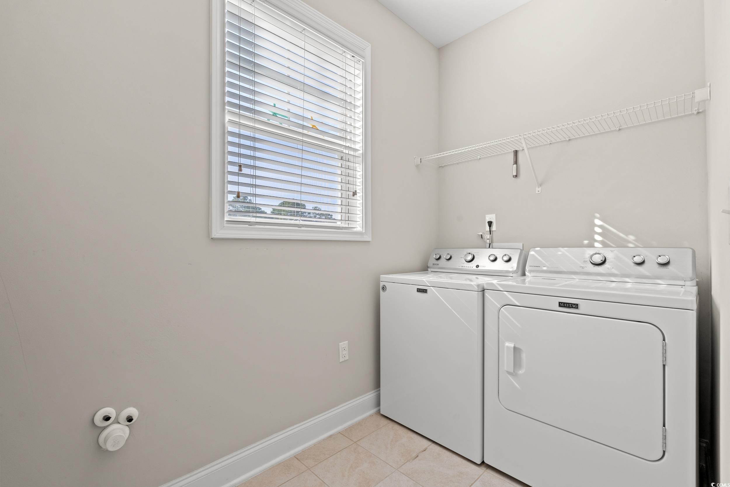 126 Viareggio Road Myrtle Beach, SC 29579 - Photo 26 of 40 Laundry area with light tile patterned floors and separate washer and dryer