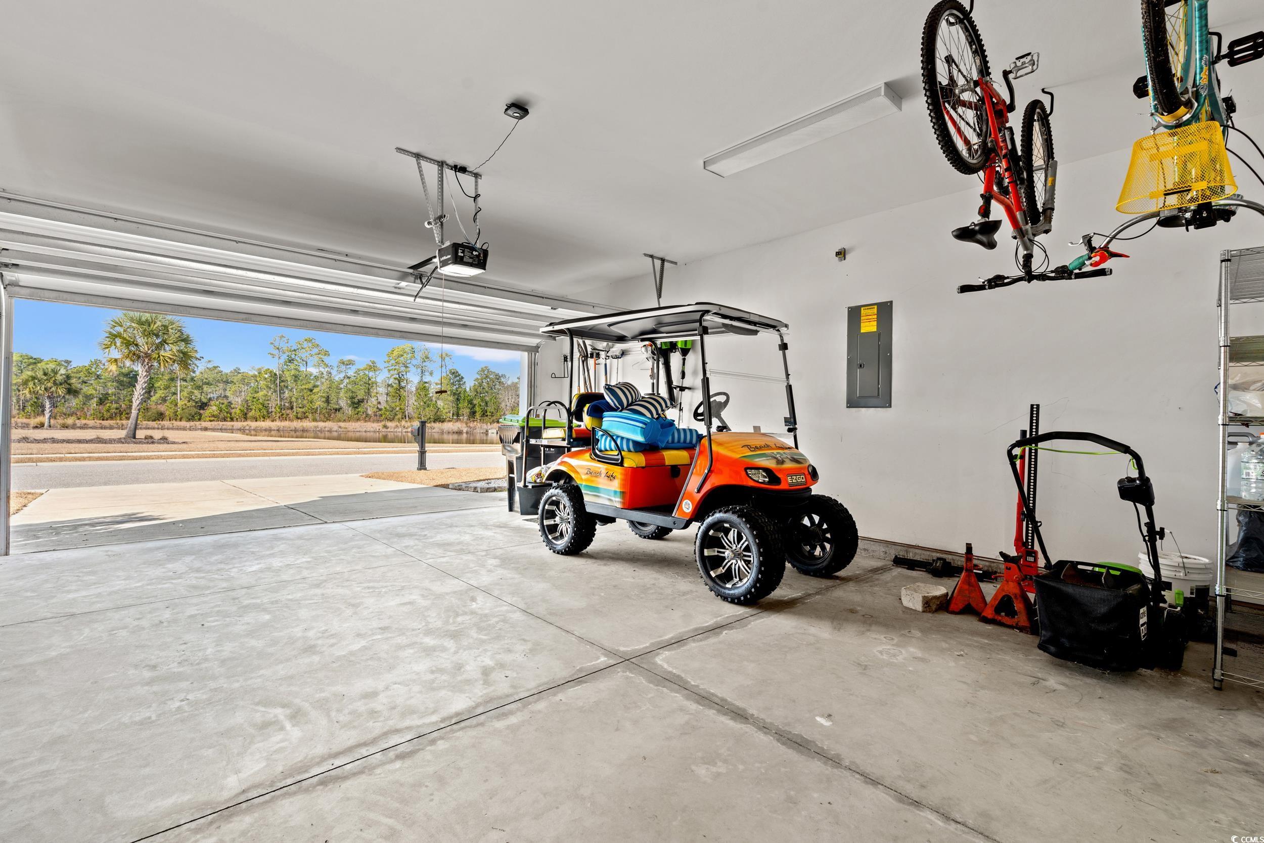 126 Viareggio Road Myrtle Beach, SC 29579 - Photo 27 of 40 Garage with electric panel and a garage door opener