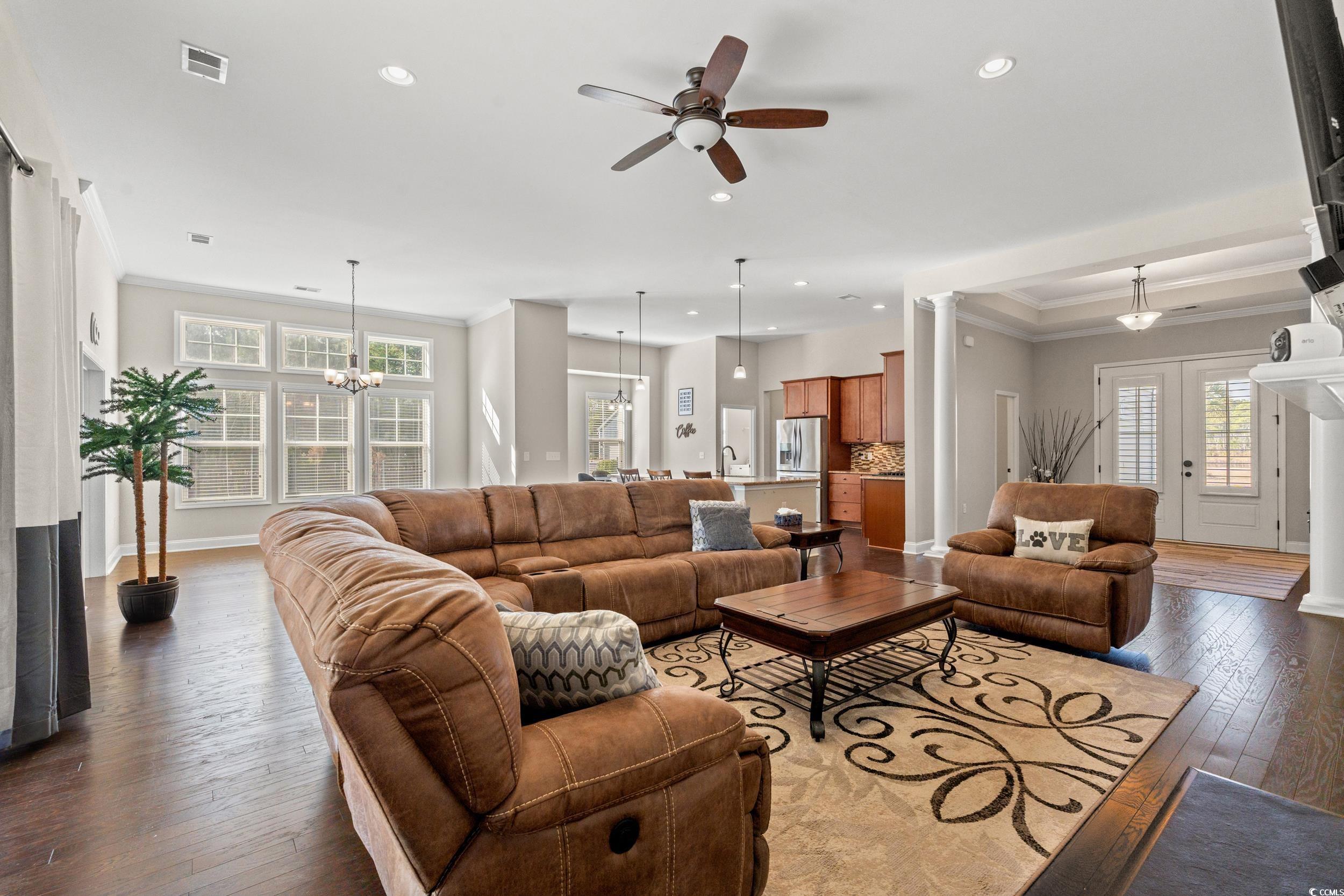 126 Viareggio Road Myrtle Beach, SC 29579 - Photo 5 of 40 Living area with crown molding, light wood finished floors, ornate columns, ceiling fan, and recessed lighting
