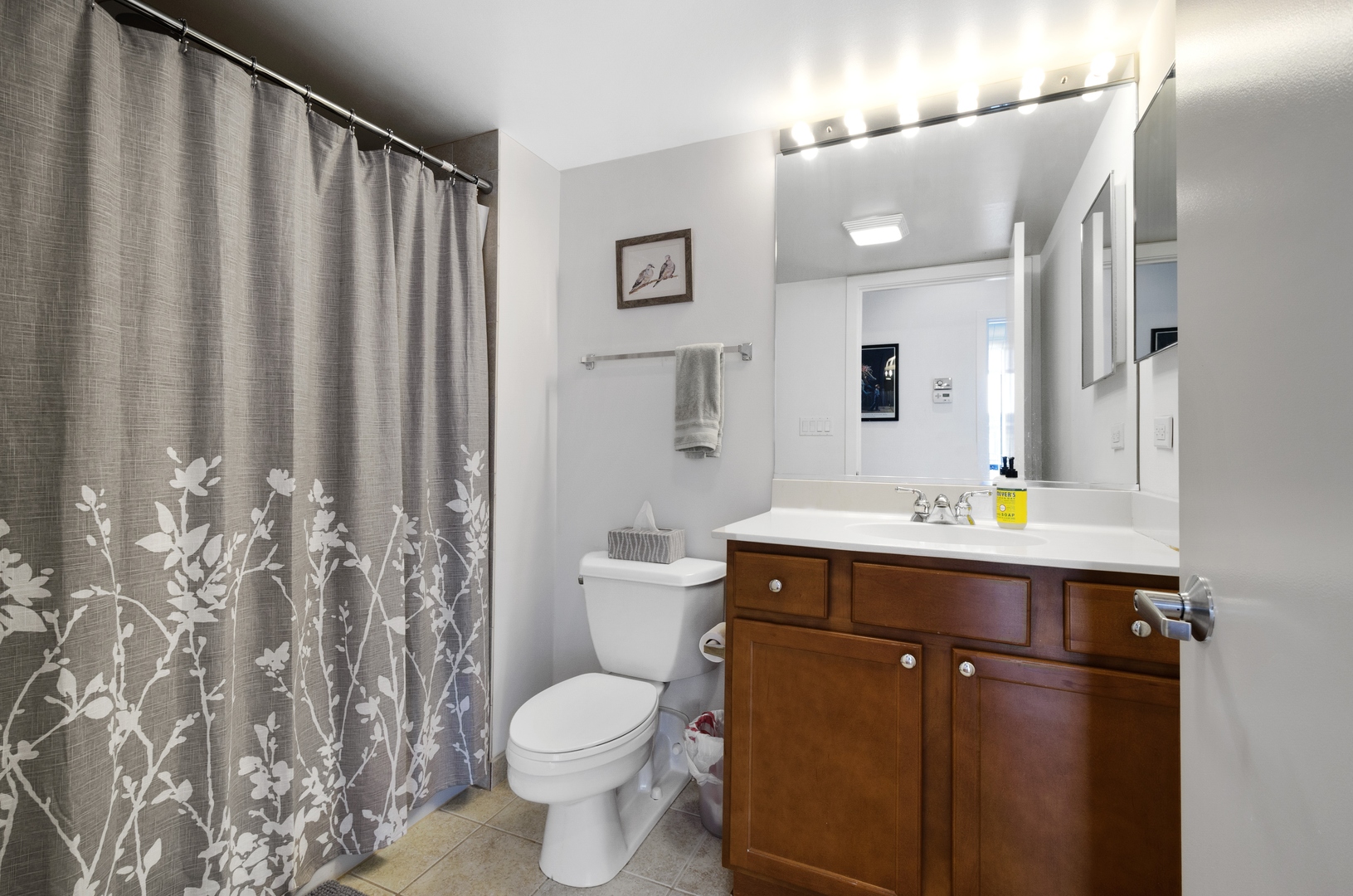 1110 West 15th Street, Unit 412 Chicago, IL 60608 - Photo 12 of 19 a bathroom with a sink toilet and shower
