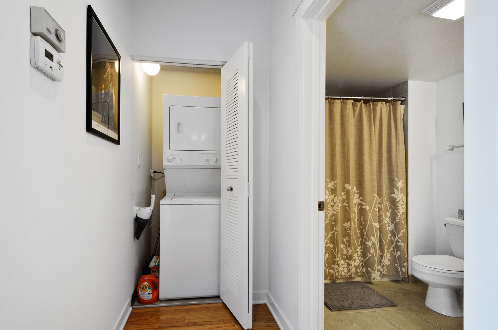 1110 West 15th Street, Unit 412 Chicago, IL 60608 - Photo 13 of 19 a bathroom with a toilet and a shower