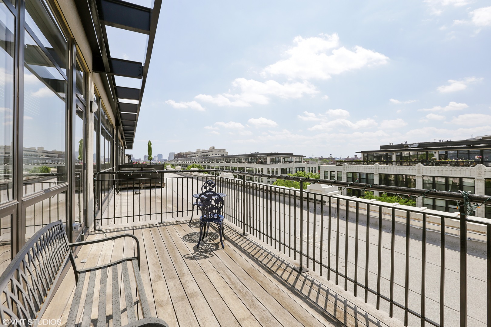 1110 West 15th Street, Unit 412 Chicago, IL 60608 - Photo 16 of 19 a view of a balcony with wooden floor