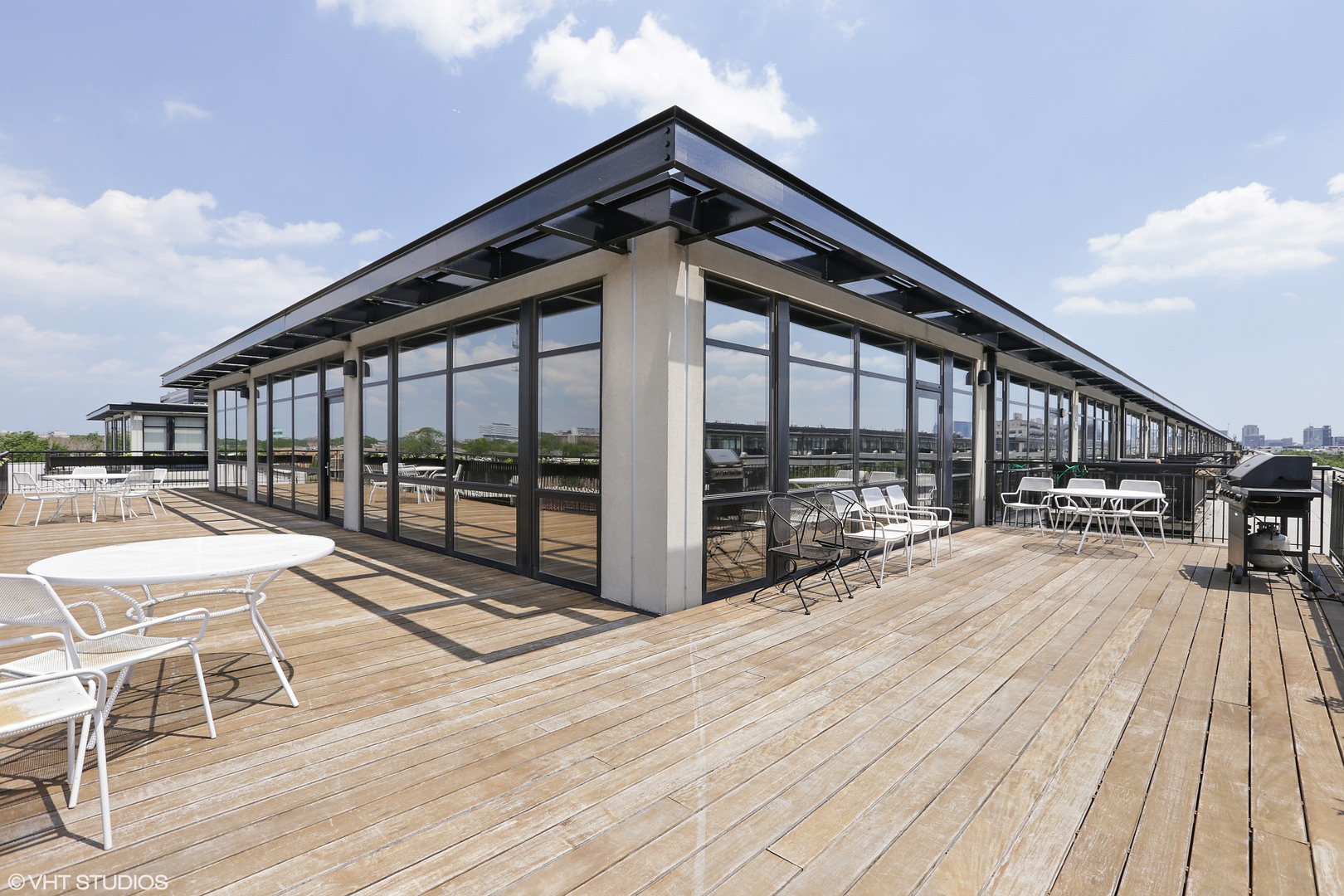 1110 West 15th Street, Unit 412 Chicago, IL 60608 - Photo 17 of 19 a view of balcony with a large window and wooden floor