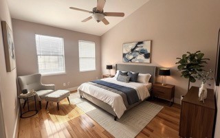 1045 Bonner Street Houston, TX 77007 - Photo 10 of 14 a bedroom with a bed and wooden floor
