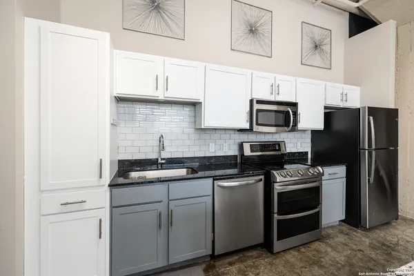 a kitchen with a table and chairs