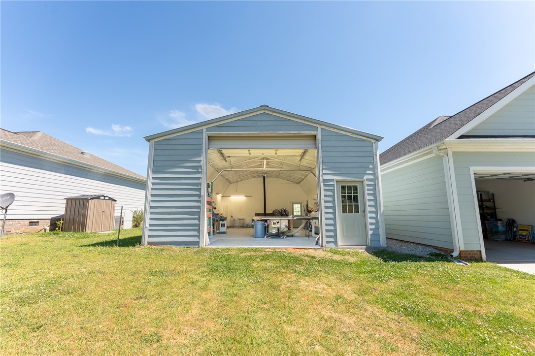 696 Mt Olivet Road Six Mile, SC 29682 - Photo 31 of 35 This spacious garage offers ample room for projects and storage, complementing the home's exterior.