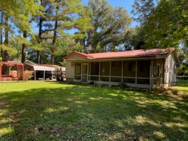 167 Frog Jump Road Brighton, TN 38011 - Photo 11 of 18 Back of house with a yard and a sunroom