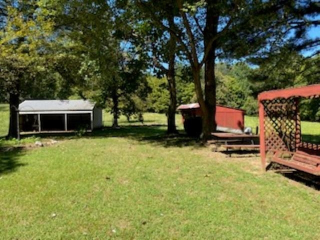 167 Frog Jump Road Brighton, TN 38011 - Photo 13 of 18 View of yard with a shed