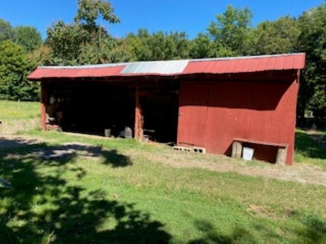 167 Frog Jump Road Brighton, TN 38011 - Photo 15 of 18 View of outbuilding with a lawn