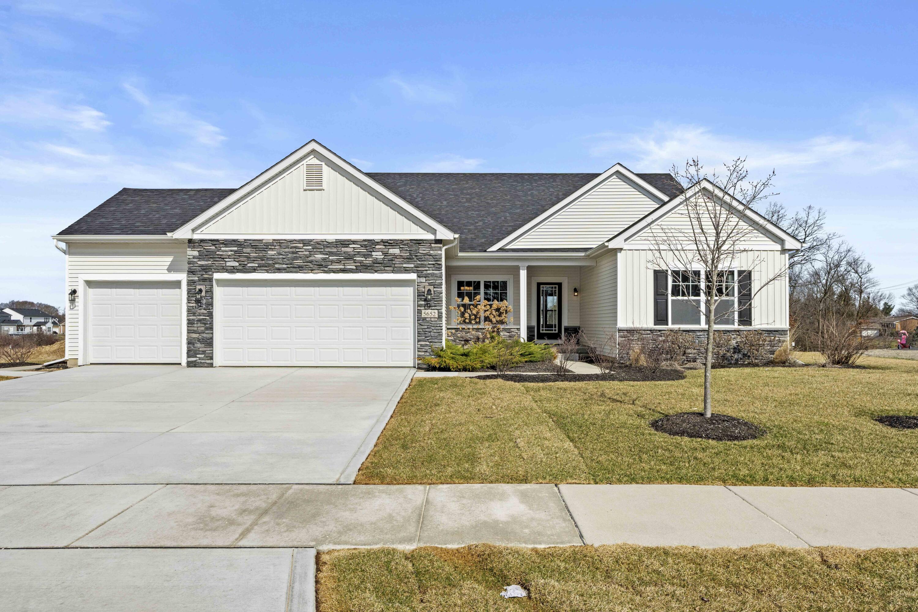 5652 Burr Rdg Circle Crown Point, IN 46307 - Photo 1 of 29 a front view of a house with a yard and garage