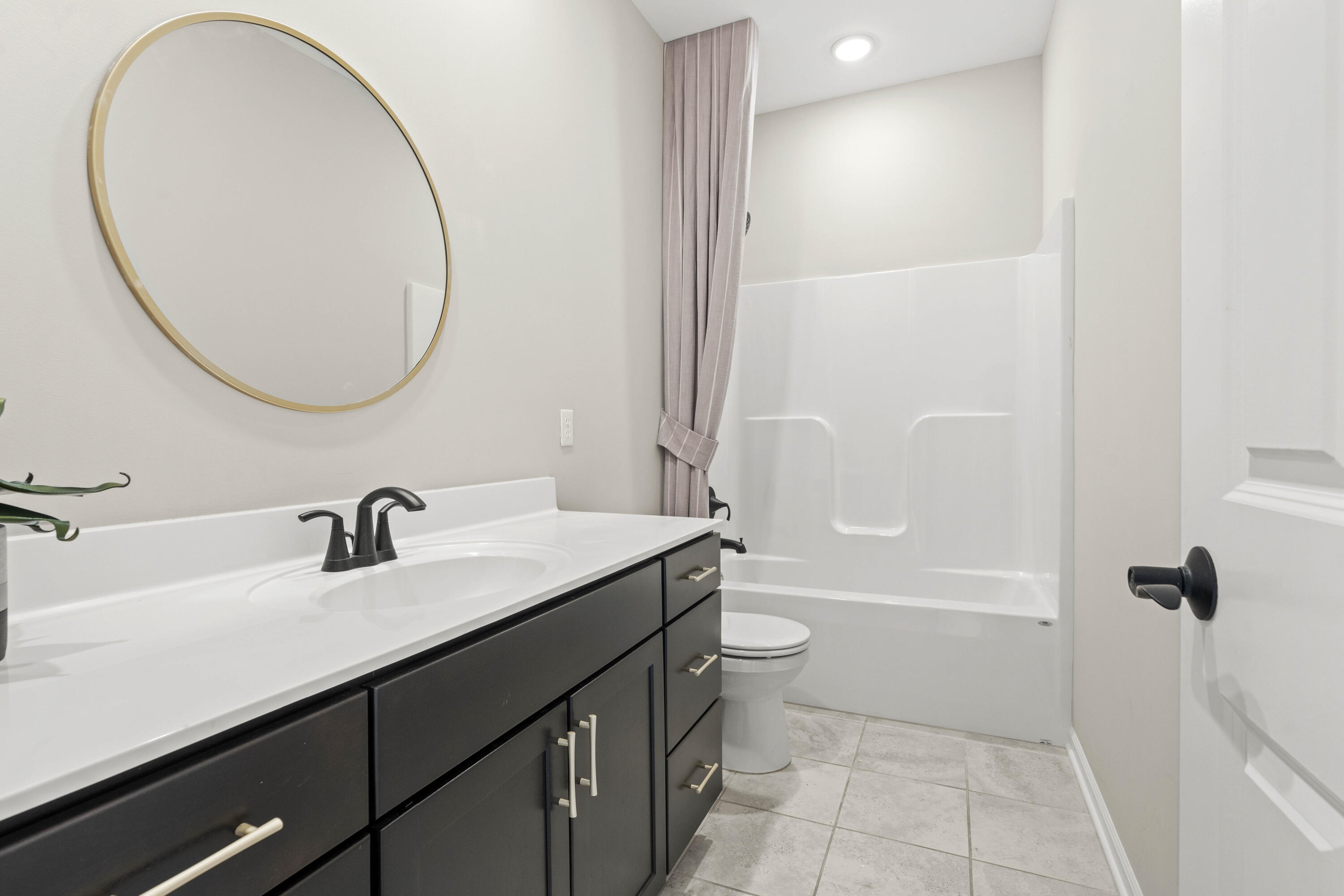 5652 Burr Rdg Circle Crown Point, IN 46307 - Photo 22 of 29 a bathroom with a sink a toilet and a mirror