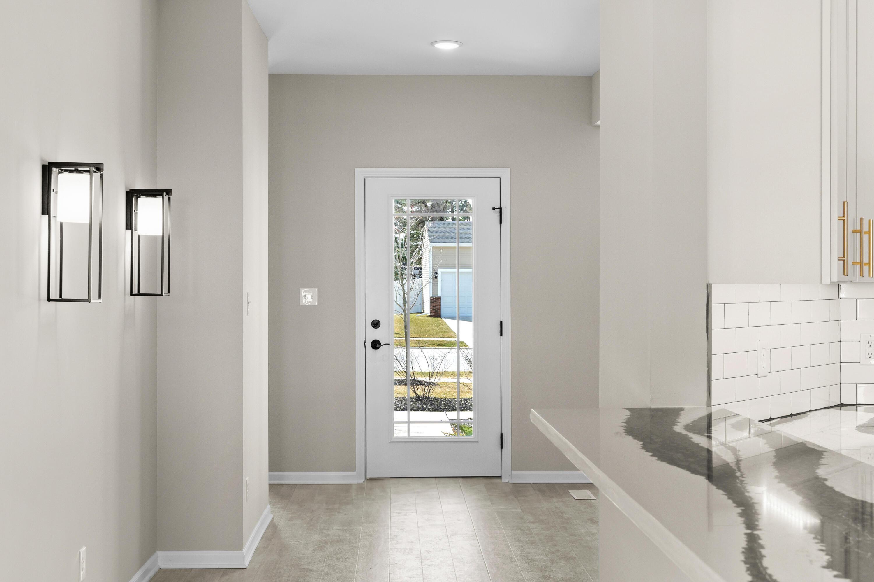 5652 Burr Rdg Circle Crown Point, IN 46307 - Photo 4 of 29 a view of a hallway to a bedroom with wooden floor and windows