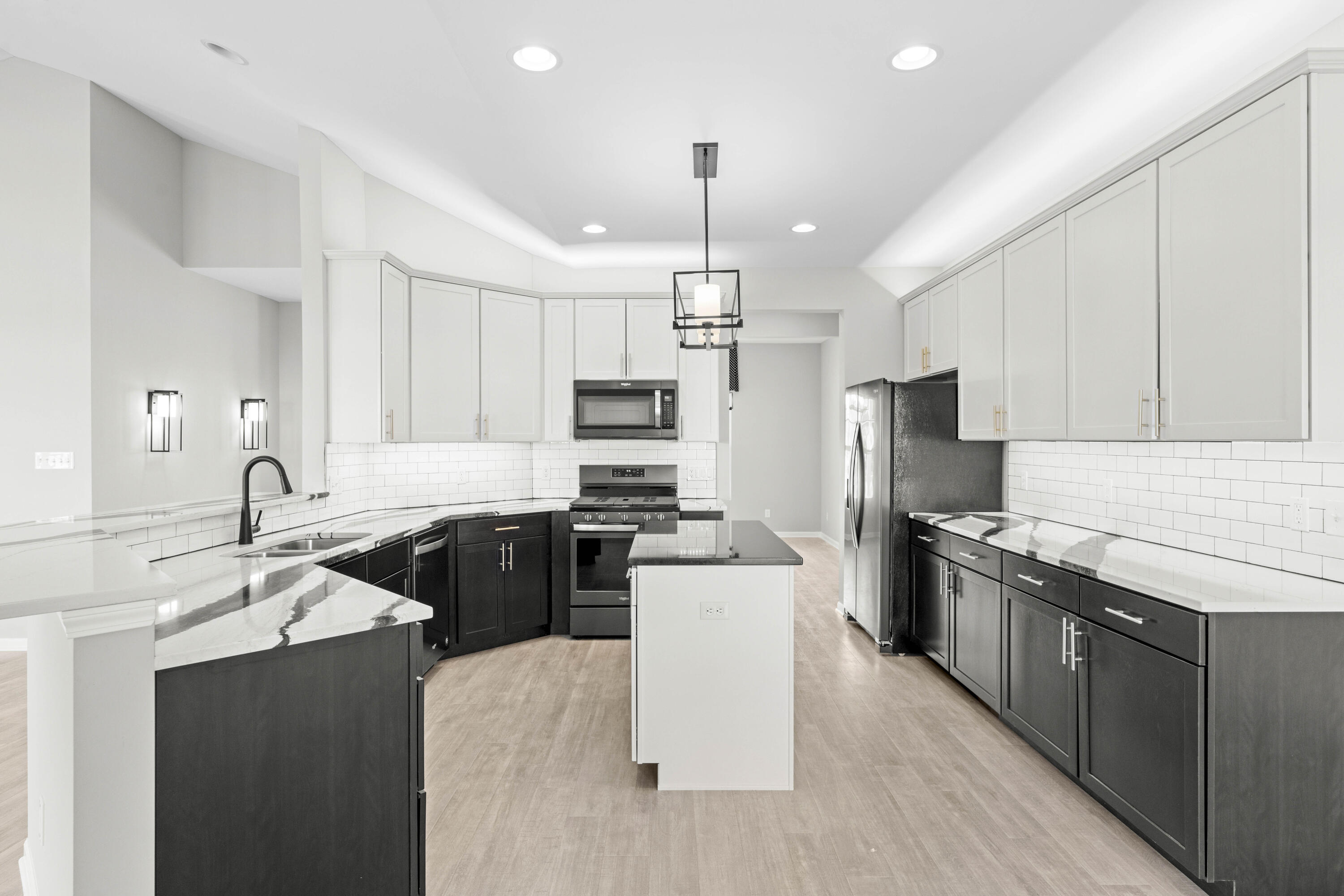 5652 Burr Rdg Circle Crown Point, IN 46307 - Photo 6 of 29 a kitchen with granite countertop a sink a counter top space stainless steel appliances and cabinets