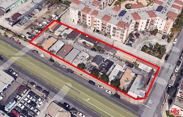 a view of a bench and trees