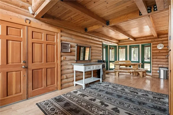 a kitchen with stainless steel appliances granite countertop a refrigerator a stove and a sink