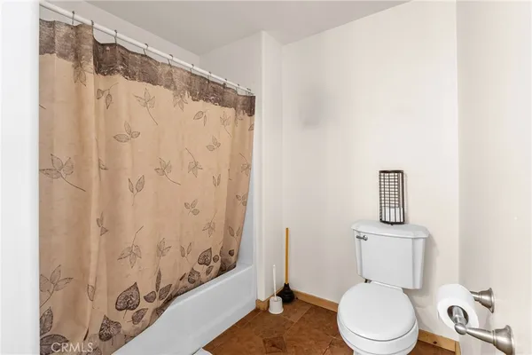 a bathroom with a sink mirror and a bathtub