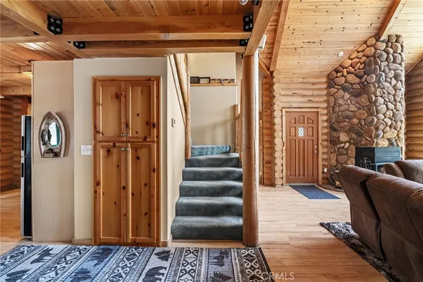 a living room with furniture and a floor to ceiling window