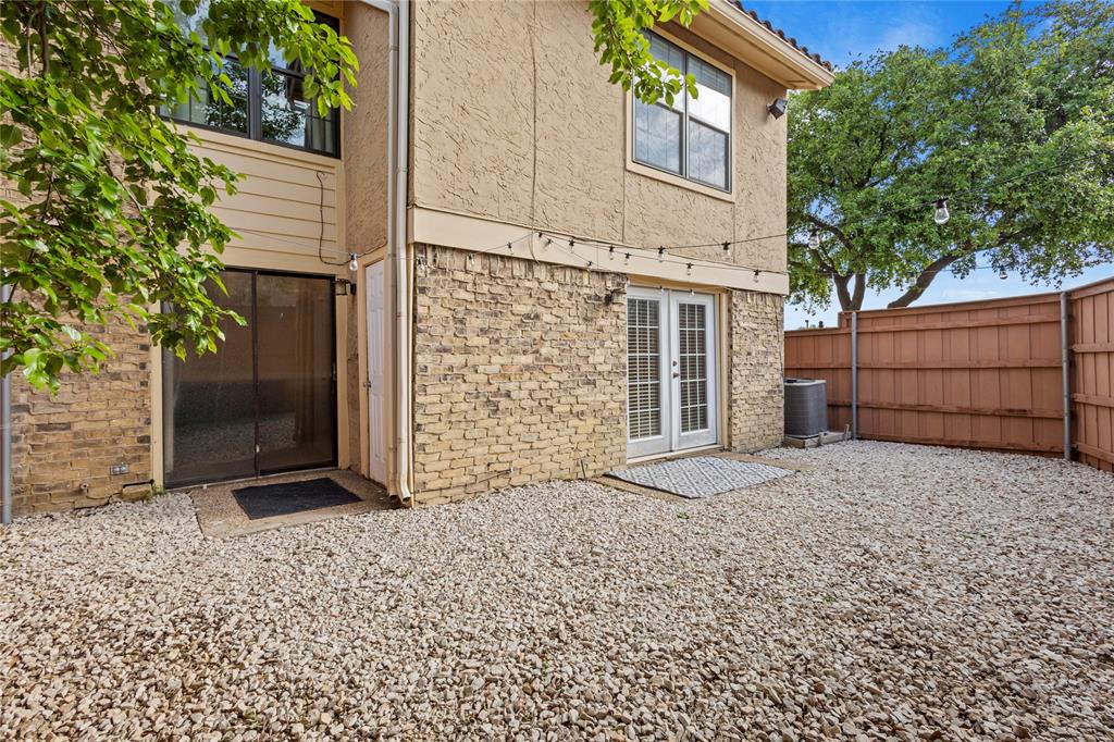 4371 Madera Road, Unit 4 Irving, TX 75038 - Photo 23 of 23 Rear view of property featuring french doors and central AC unit