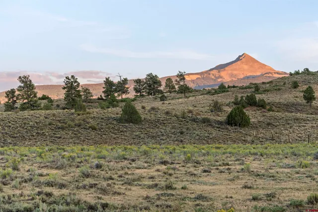 a view of an ocean and a mountain
