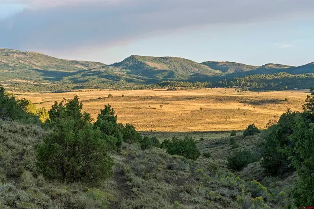 a view of an ocean and a mountain