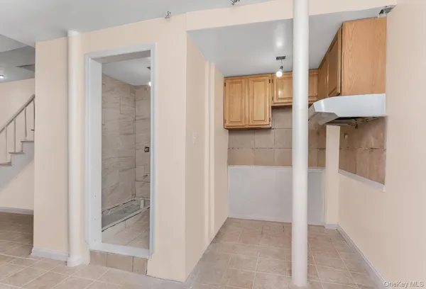 a bathroom with a shower and a sink