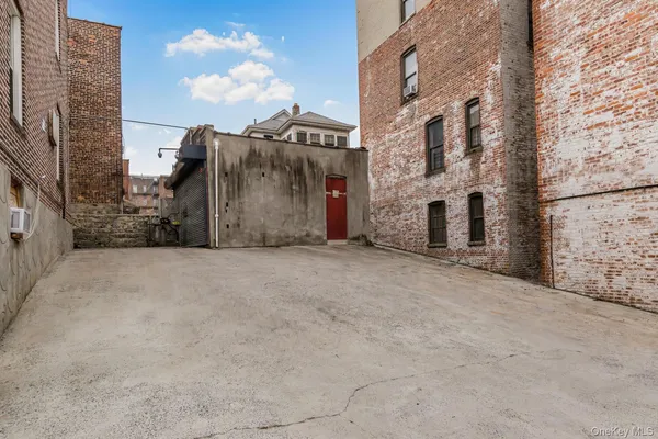 a view of a street with brick building