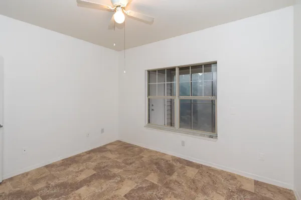 an empty room with a bathroom