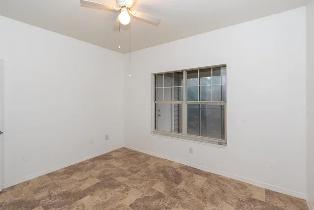 an empty room with a bathroom