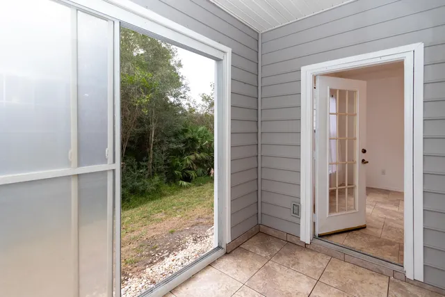 a view of a back yard from a room