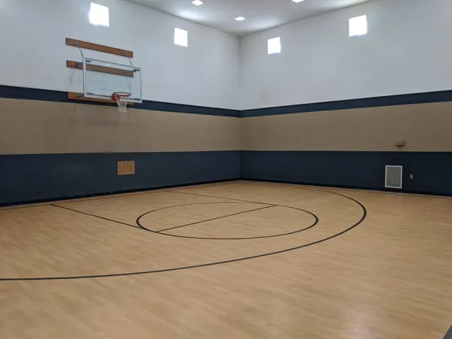 a view of a workspace with furniture and wooden floor