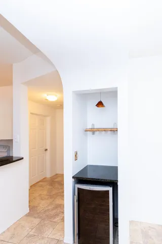 a kitchen with a refrigerator and cabinets