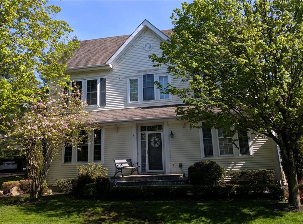 a house that has a tree in front of the house