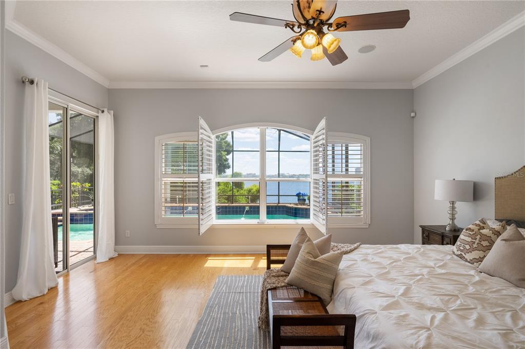 8119 Vía Rosa Orlando, FL 32836 - Photo 20 of 62 a bedroom with a bed and wooden floor