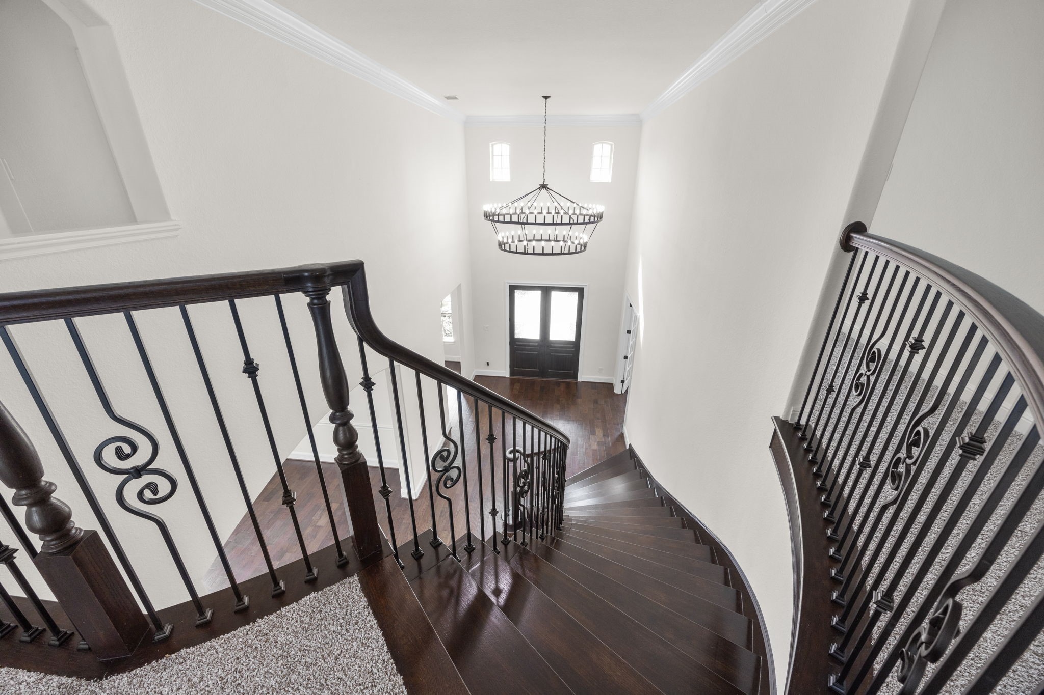 8551 Tombron Grove Road Magnolia, TX 77354 - Photo 35 of 49 At the top of the stairs, your greeted by an elegant open landing that beautifully overlooks the dramatic foyer below.