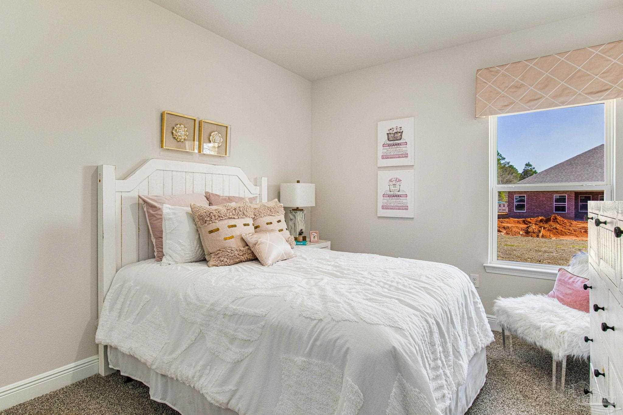 3821 Eagle Tail Drive Jay, FL 32565 - Photo 19 of 27 a bedroom with a bed and wooden floor