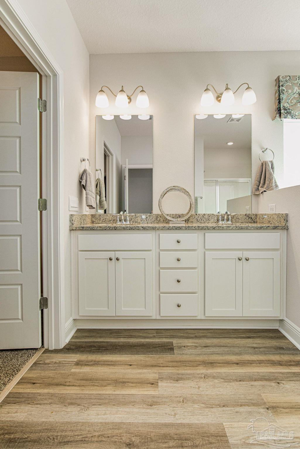 3821 Eagle Tail Drive Jay, FL 32565 - Photo 25 of 27 a bathroom with a sink double vanity granite and a mirror