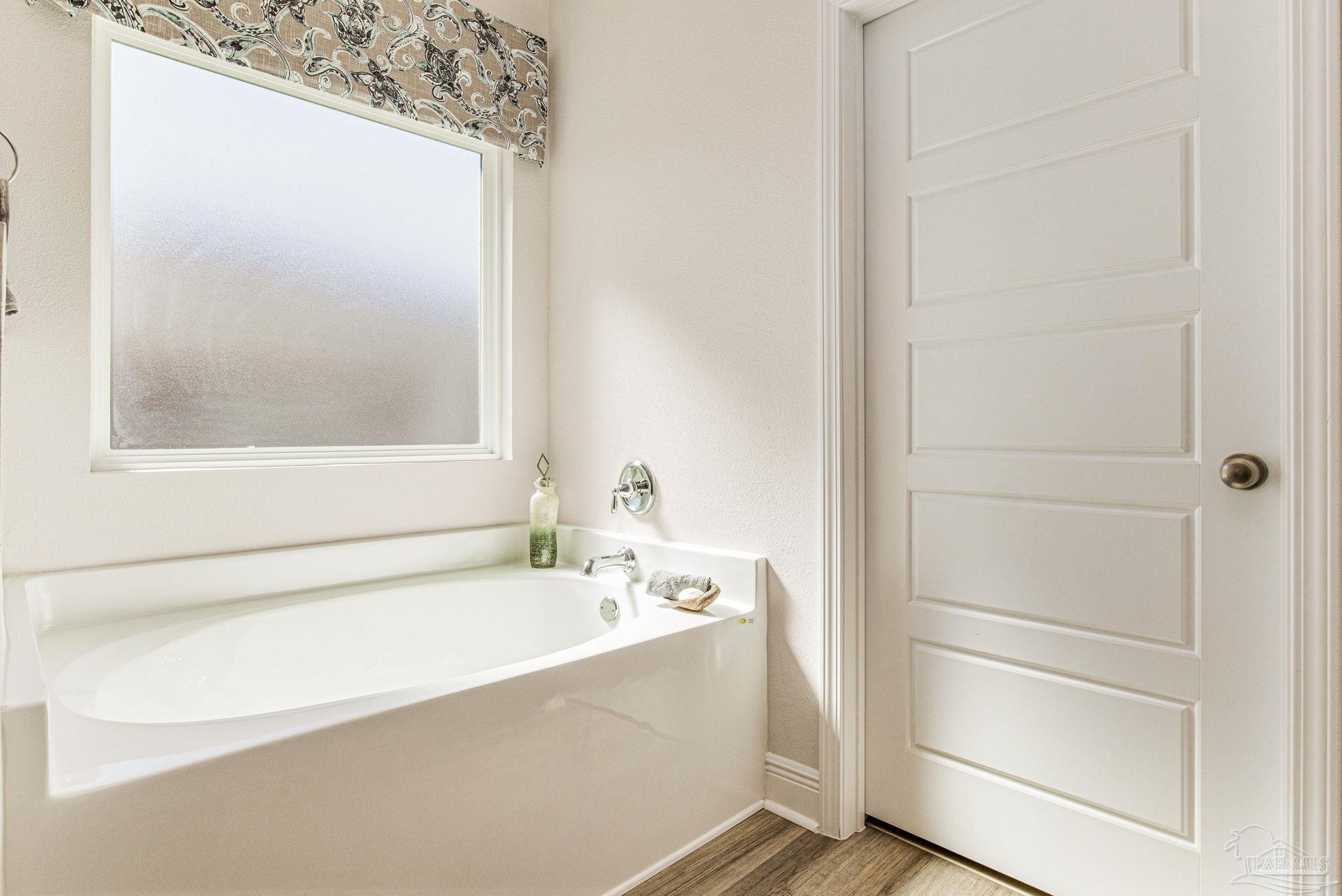 3821 Eagle Tail Drive Jay, FL 32565 - Photo 27 of 27 a bathroom with a bathtub and a sink