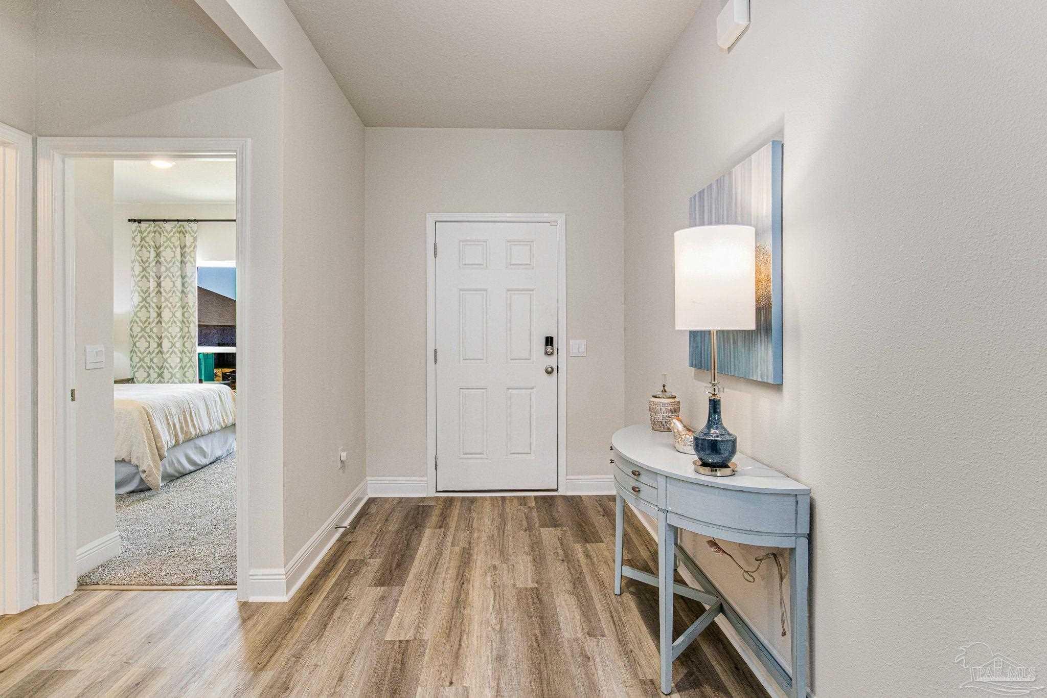 3821 Eagle Tail Drive Jay, FL 32565 - Photo 3 of 27 a view of an entryway with wooden floor