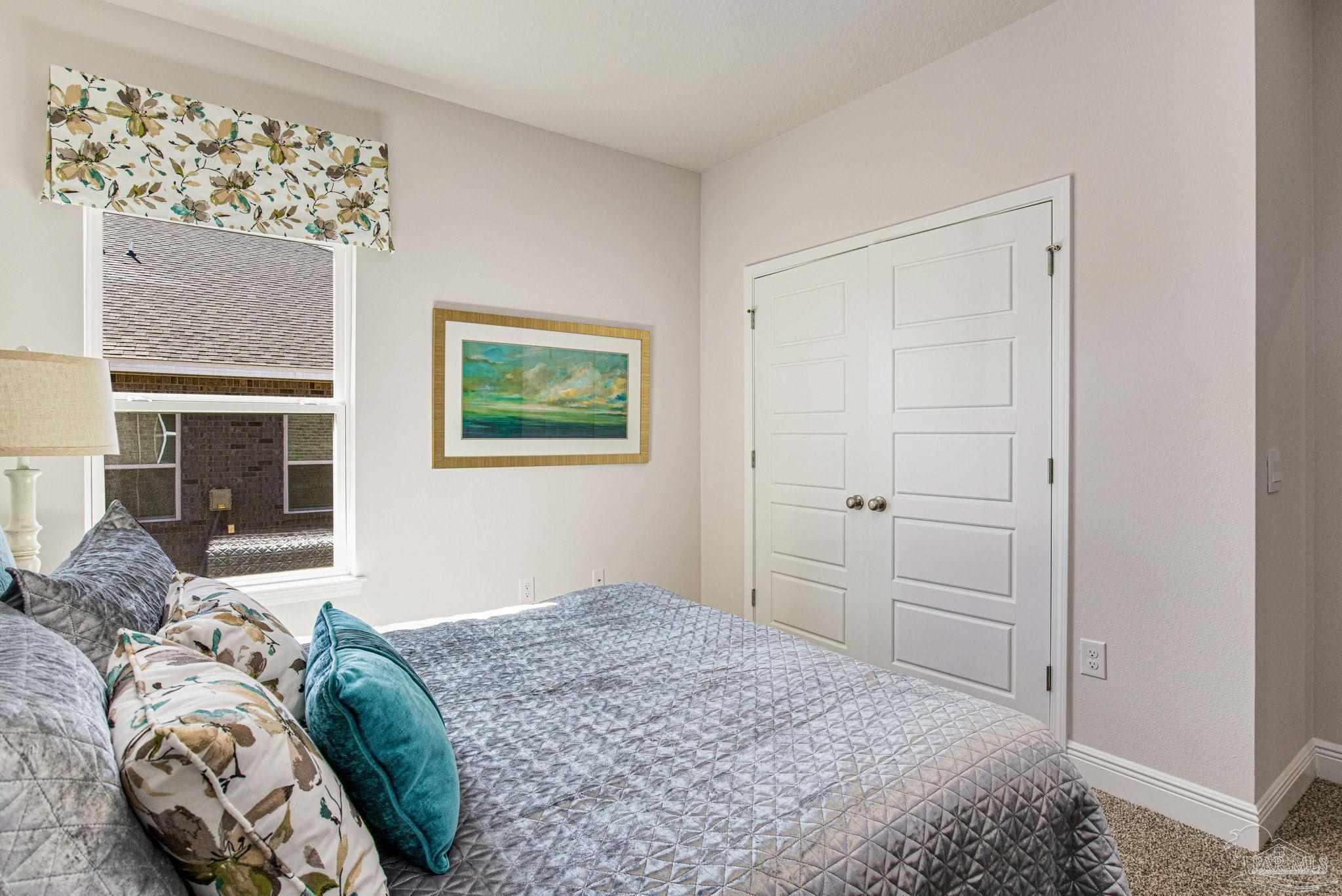 3821 Eagle Tail Drive Jay, FL 32565 - Photo 5 of 27 a bedroom with a bed and a window