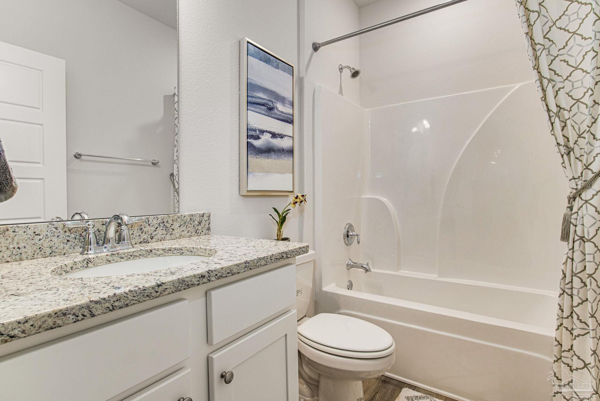 3821 Eagle Tail Drive Jay, FL 32565 - Photo 8 of 27 a bathroom with a granite countertop sink toilet and shower