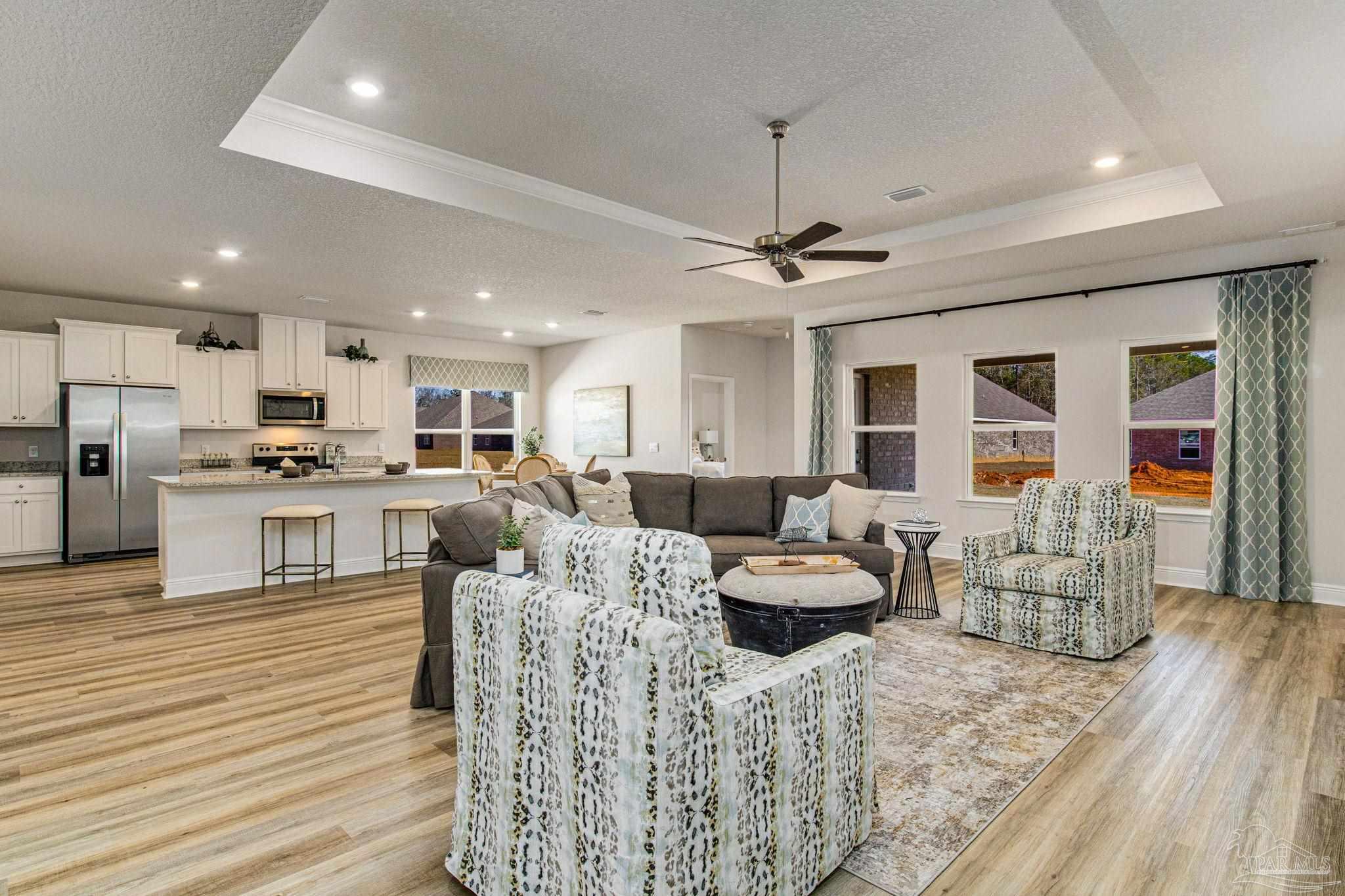 3821 Eagle Tail Drive Jay, FL 32565 - Photo 10 of 27 a living room with furniture and kitchen view