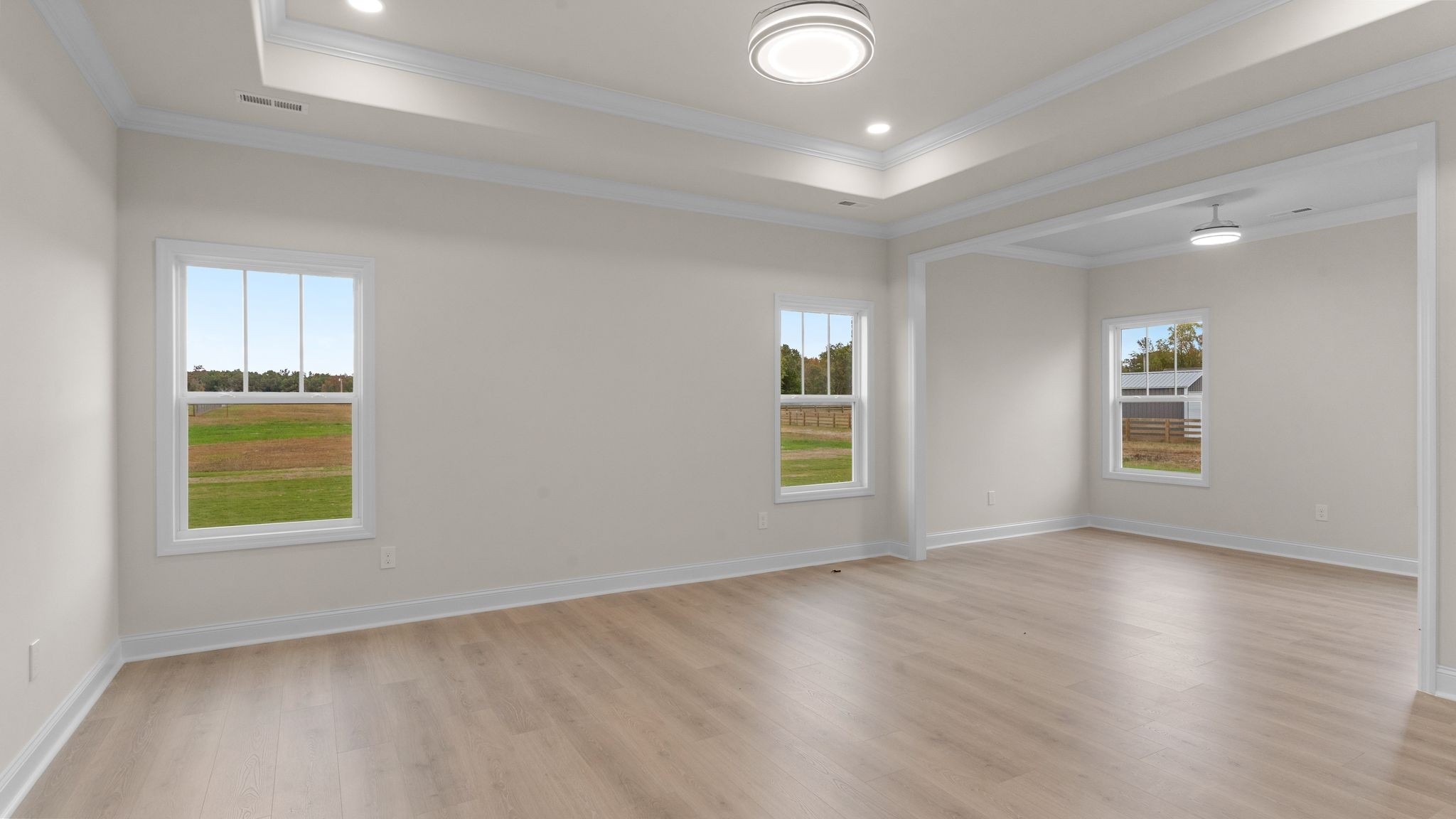 56 Old Quick Road Fayetteville, TN 37334 - Photo 17 of 32 an empty room with a window and wooden floor