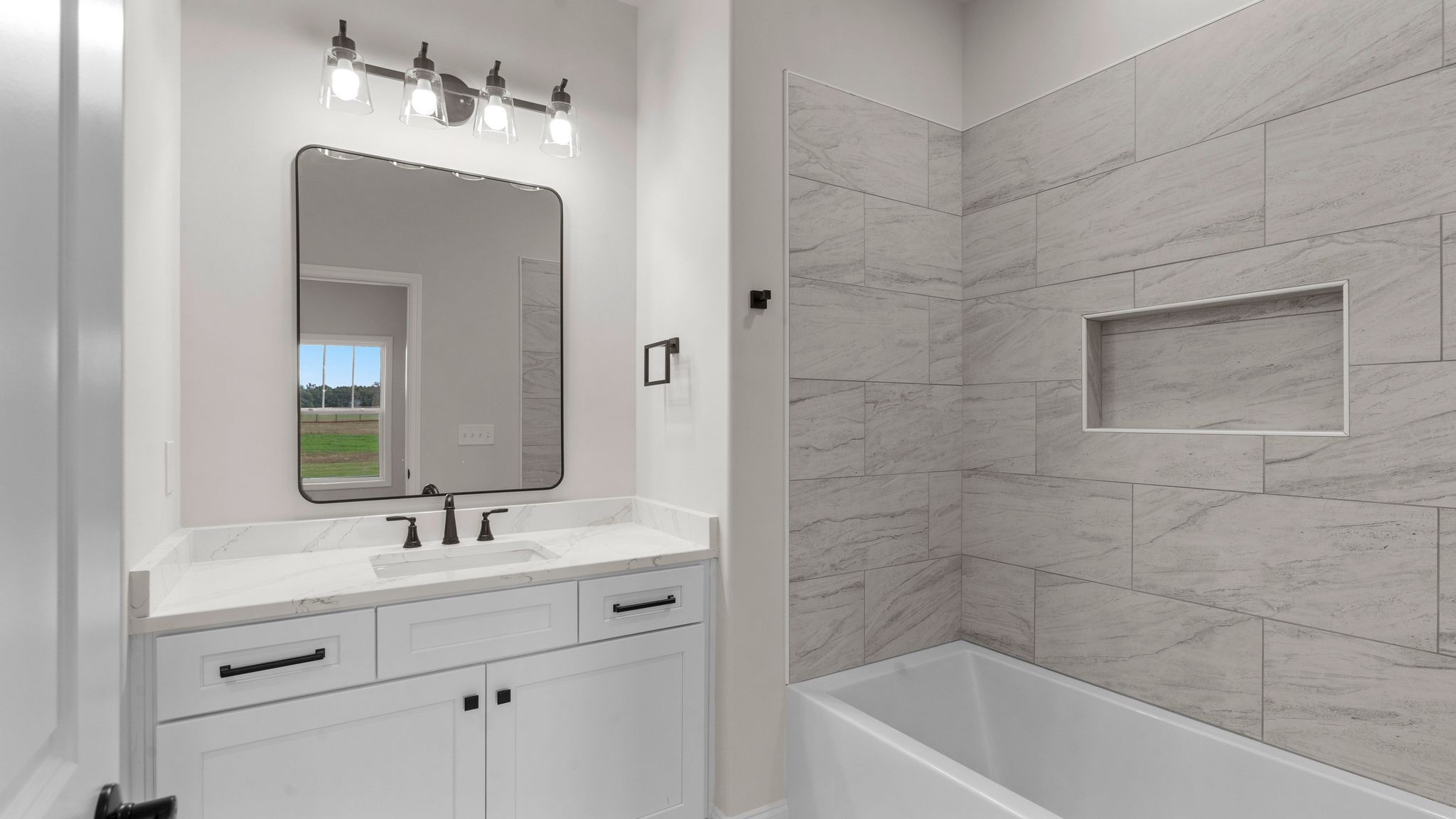 56 Old Quick Road Fayetteville, TN 37334 - Photo 26 of 32 a bathroom with a bathtub shower sink and mirror