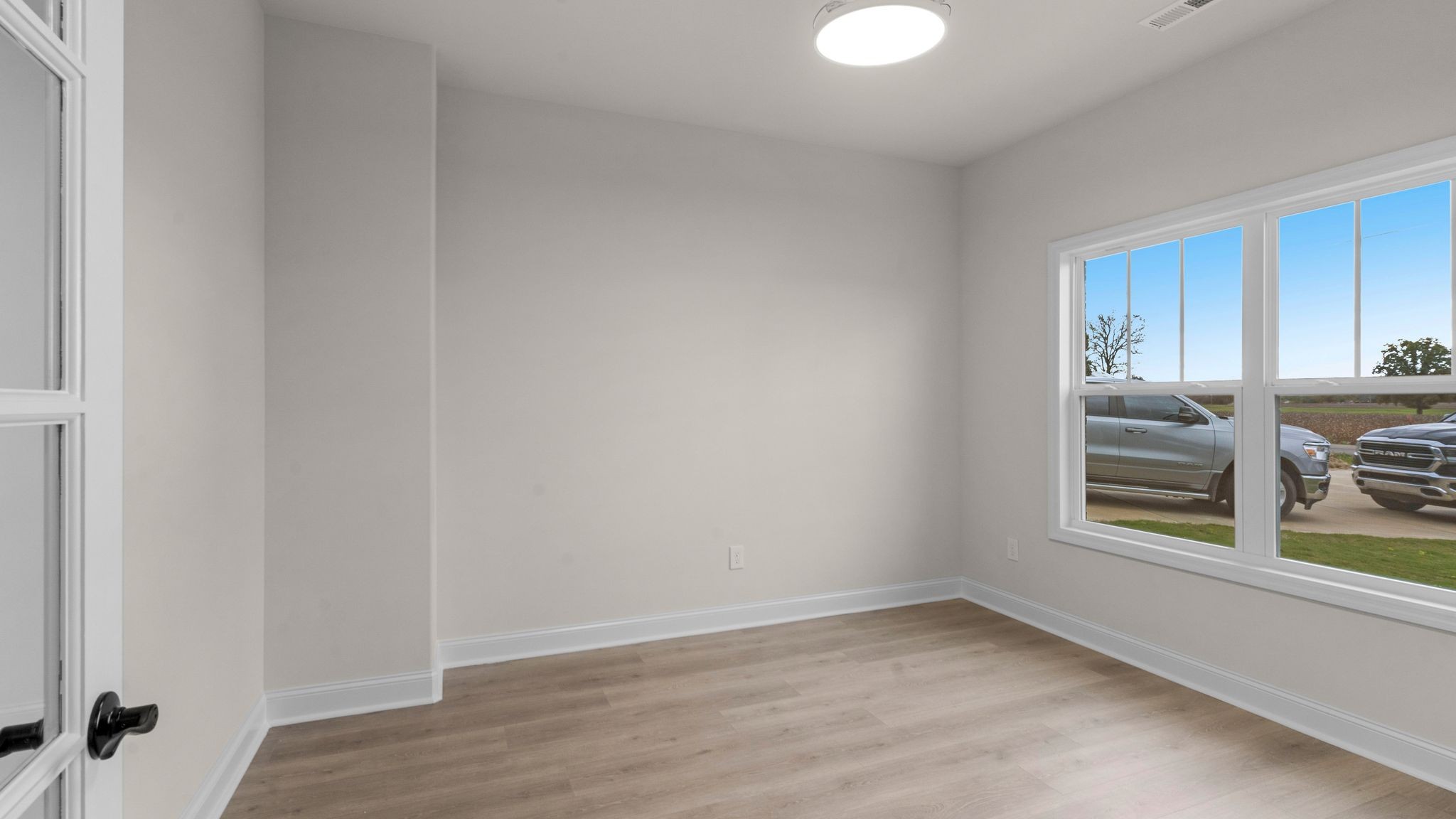 56 Old Quick Road Fayetteville, TN 37334 - Photo 5 of 32 a view of empty room with wooden floor and fan