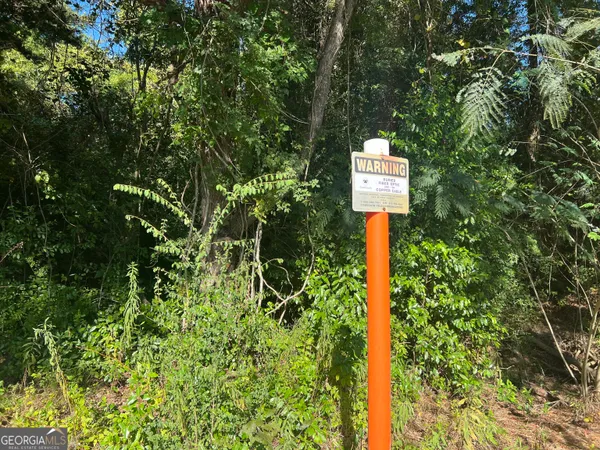 a sign that is on a tree