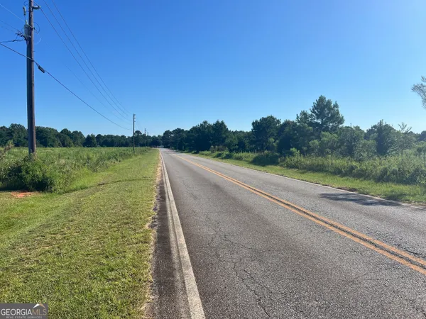 a view of a lake view with large trees