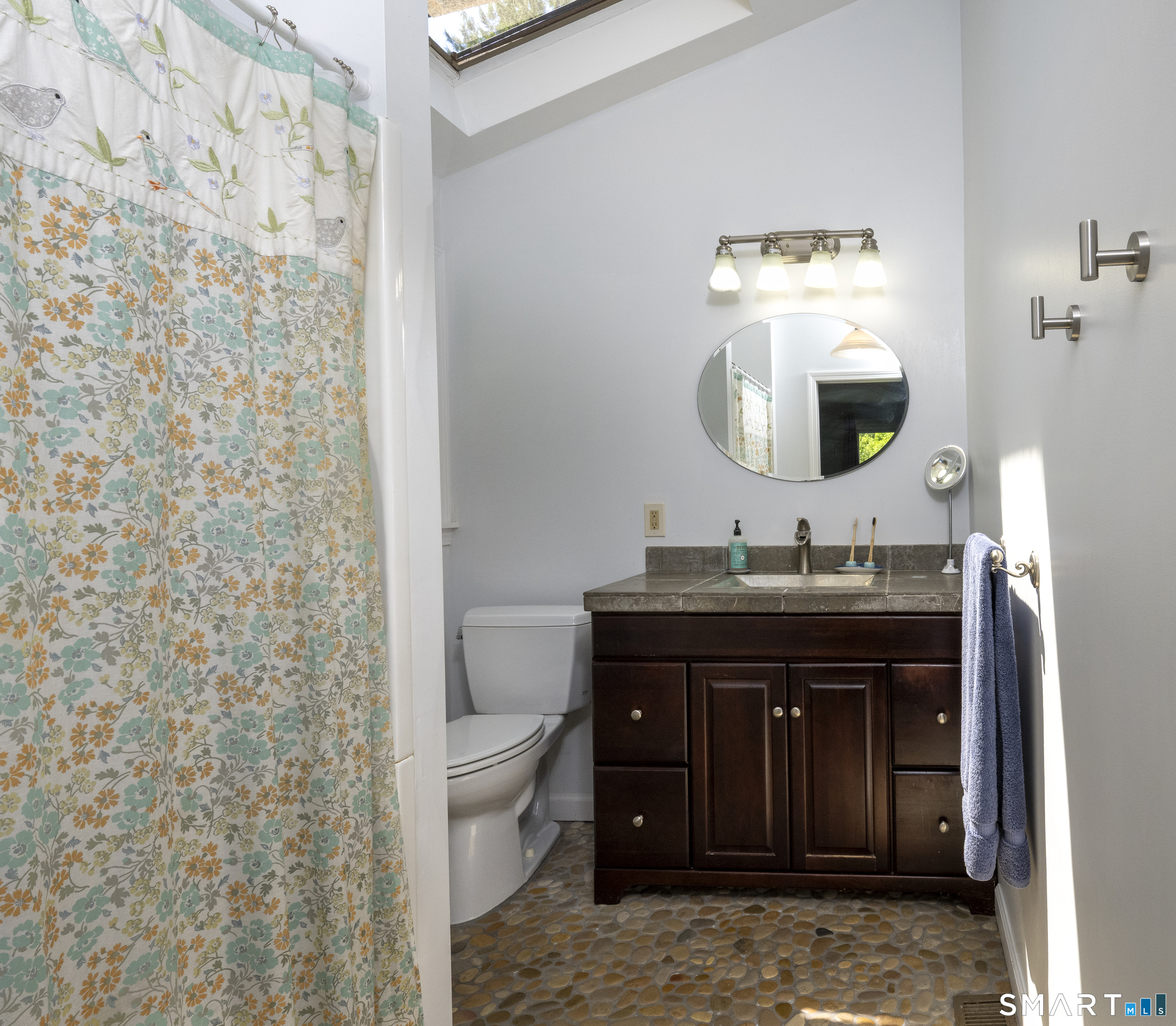 7 Chimney Rock Road Kent, CT 06757 - Photo 18 of 35 a bathroom with a granite countertop sink a toilet and a mirror