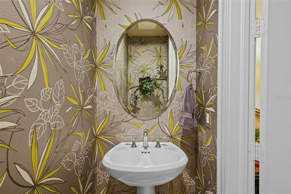 a bathroom with a sink and a mirror