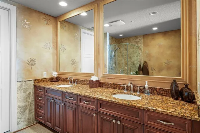 a bathroom with a double vanity sink and a mirror